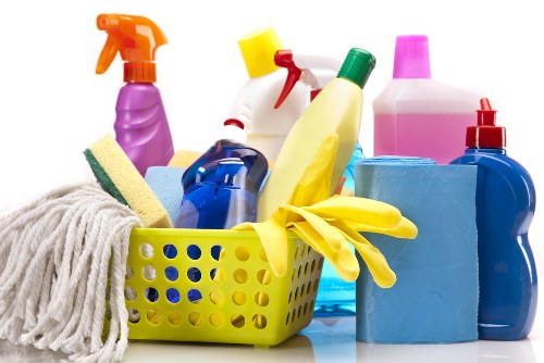 Carpet cleaning technician preparing safety equipment in SW13
